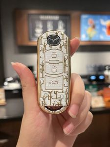 ỐP CHÌA KHOÁ XE Mada loại 3 nút bấmMazda2 Mazda3 Mazda6 Mazda Cx5 CX8 chìa thon-TPU DIOR mạ vàng Cap Cấp