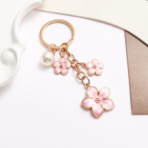 INEXTIN Alloy Sakura Keychain Cherry Blossom Enamel Coating Cherry Blossom Keychain Durable Pearl Accent Cute Bag Charm For Women