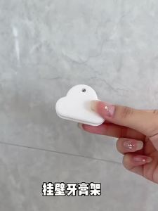 Toothpaste storage rack squeezing toothpaste tool bathroom wall mounted storage clip wall punch free facial cleanser push clip