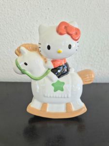 Sanrio Hello Kitty on a rocking horse coin bank