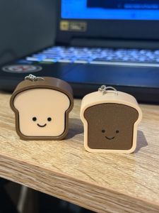 Bread-shaped keychains with smiling faces