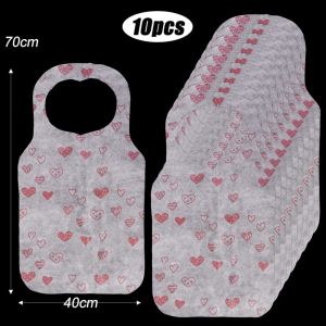 GOODOO 10Pcs/Bag พิมพ์ลายหัวใจ ผ้ากันเปื้อนใช้แล้วทิ้ง น้ำมันหลักฐาน ป้องกันคราบสกปรก ผ้ากันเปื้อนสำหรับเด็ก แบบพกพาได้ ผ้าไม่ทอ ผ้ากันเปื้อนทำอาหารผ้ากันเปื้อน เครื่องใช้ในบ้านร้านอาหาร