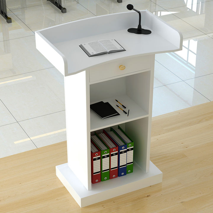 The reception desk hosts the emcee platform, the podium, the small ...