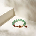 Vòng tay lắc tay đá thạch anh dâu charm hoa 4 cánh garnet mạ vàng may mắn phong thủy Udumbara quà biếu tặng sang trọng. 