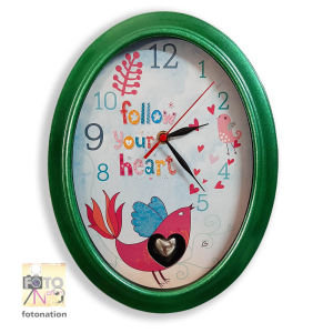 Pendulum Wall Clock with message "Follow Your Heart". Nice gift idea for housewarming newly-weds. With heart pendulum