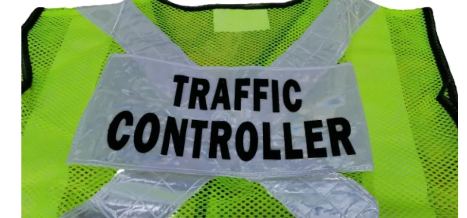 Safety Vest with TRAFFIC CONTROLLER Label.