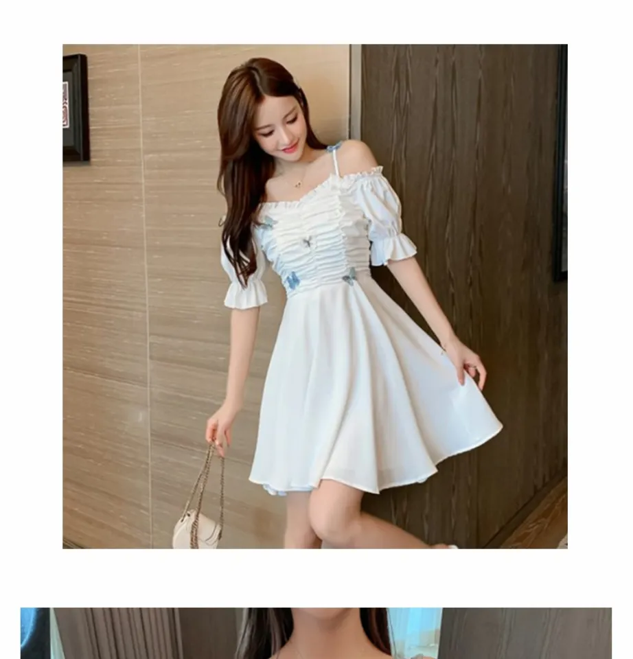 Korean woman in white dress and blue cardigan with long straight hair  standing with her hands together and smiling Stock Photo - Alamy