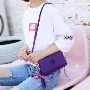 กระเป๋าสตางค์ยาวสําหรับผู้หญิงทําจากวัสดุไนลอนพร้อมซิปเปอร์ ออกแบบสีทึบ กระเป๋าสะพายหลังที่หลากหลายสําหรับผู้สูงอายุกลางคน