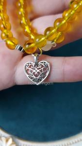 Vòng tay đá Thạch Anh Vàng size 6.2 li kiểu quấn 2 vòng phối charm trái tim cỏ 4 lá bánh xe thạch anh hồng hợp mệnh Thổ Kim | Hoa Minh Gem